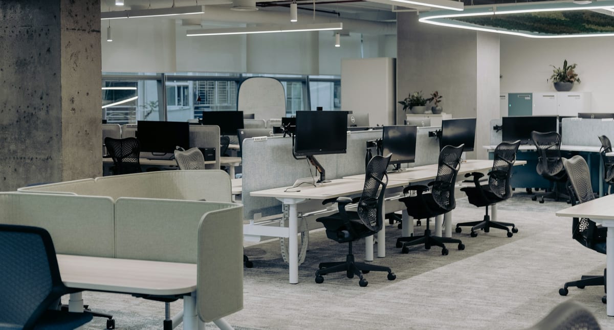 Office furniture arranged in a contemporary workspace