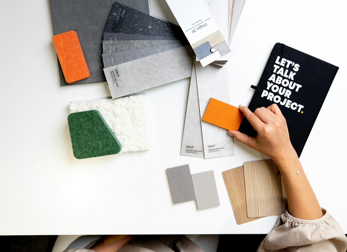 Interior material board with furniture, lighting and flooring samples
